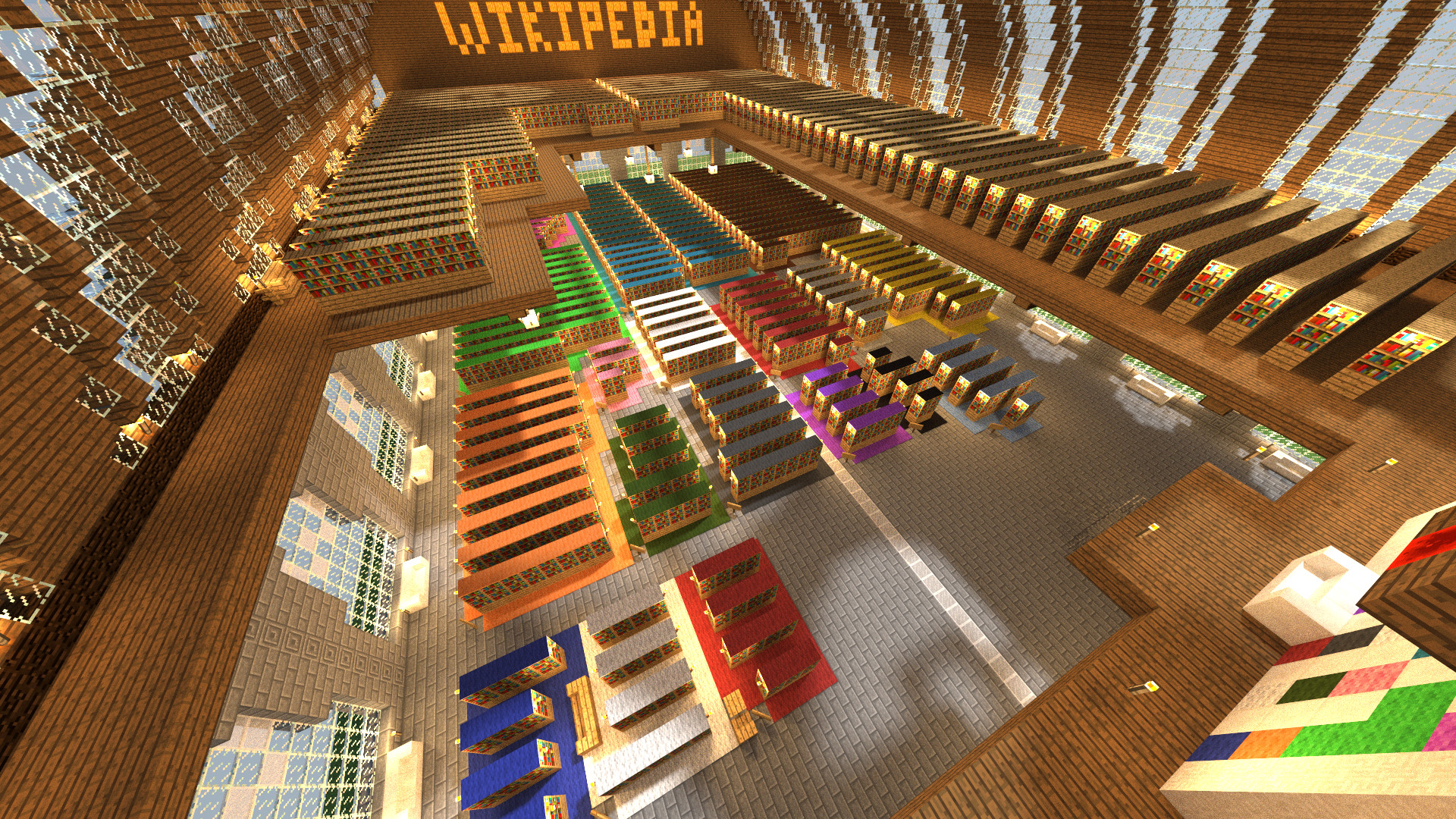 Vue en contre plongée d'une bibliothèque de deux étages contenant de grands rayonnages de
livres.